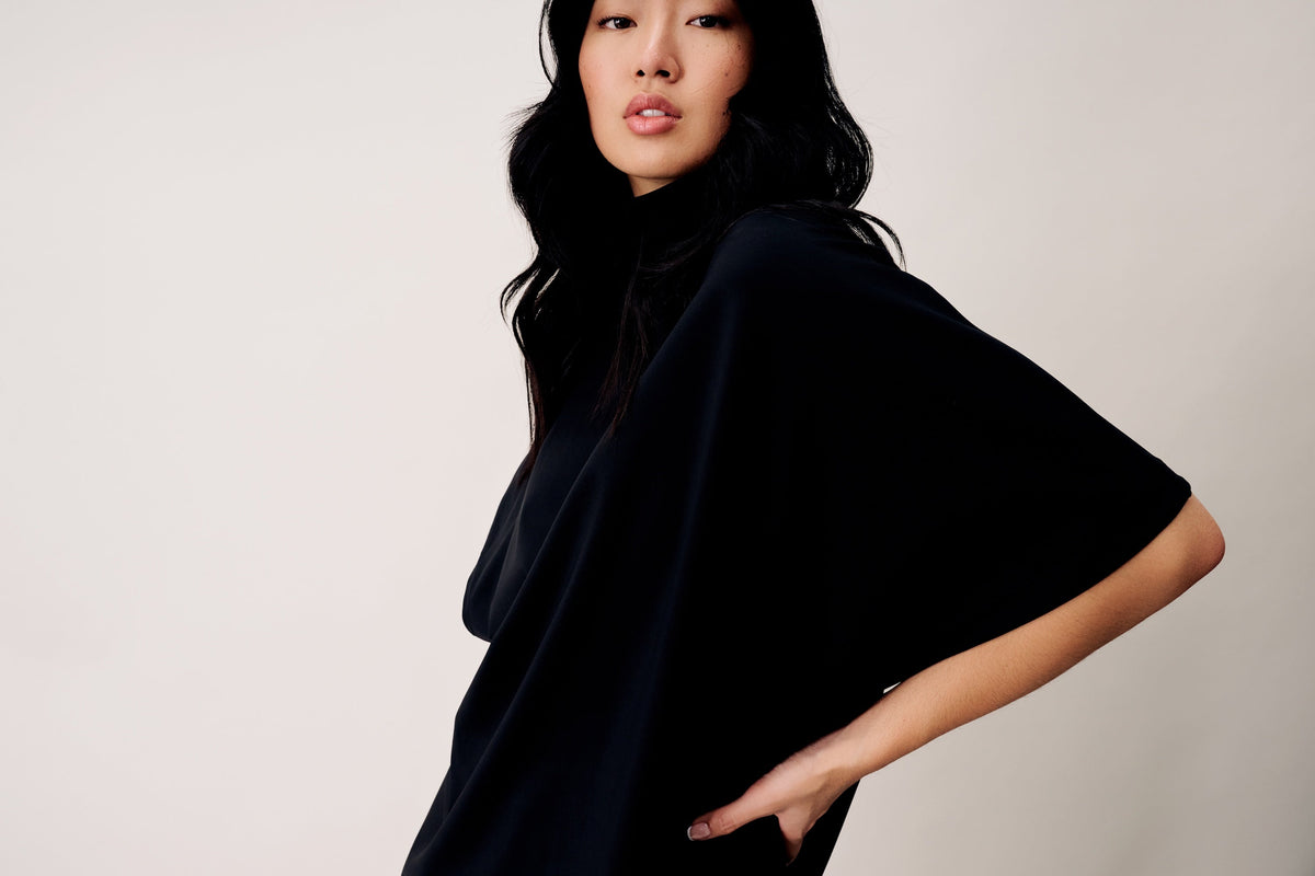 Model is wearing the Willow Dress from the Garden Collection in Black Rose.