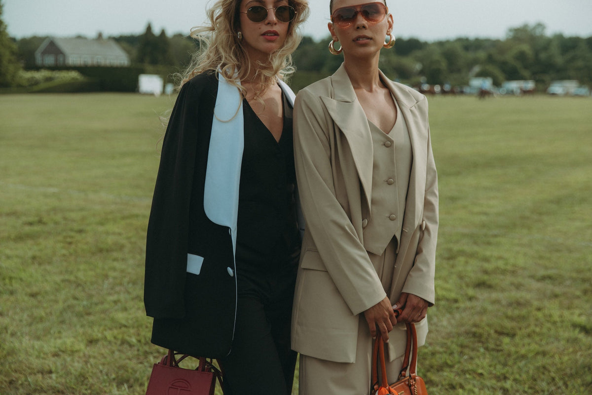 Models are wearing the Magnolia Suit Set in Black Rose and Jasmine and the Dahlia Blazer, Peony Pant, and Gardenia Vest in the color Birch