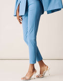 Model wearing Cool Intentions Pant in blue with sleek design and stylish heels.