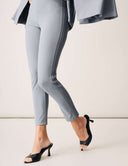 Model showcasing Cool Intentions Pant in sleek gray with double pleats and modern design, paired with stylish heels.