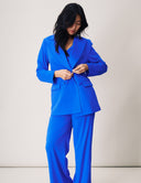 Model in a bold blue Dahlia Blazer and matching pants, showcasing a stylish and structured look.