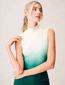 Model wearing the Luxe Ombre Bodysuit in a green ombre gradient with turtleneck design and elegant styling.