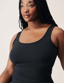 Model wearing Luxe Tank Top, showcasing its sleek sleeveless design and flattering fit.