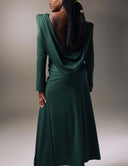 Model showcasing the No Turning Back dress with a draped open back and cowl, highlighting its elegant silhouette.