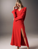 No Turning Back dress with long sleeves, V-neckline, and high slit, showcasing elegant fluid detail.