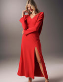 No Turning Back dress with long sleeves, V-neckline, and high slit, showcasing elegant fluid detail.