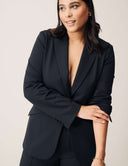 Model wearing the Perfect Form Blazer styled elegantly, showcasing sophisticated tailoring details.
