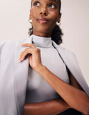 Close-up of a woman wearing the Power Shift Blazer, showcasing its sophisticated design and elegant details.