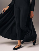 Model wearing the Promise Me Nothing Pant with a flowing outer layer and stylish flats.