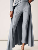 Promise Me Nothing Pant in light blue with tapered leg and pintuck front seams, styled for modern elegance.