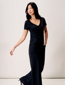 Model wearing a black V-Neck Luxe Tee, showcasing its relaxed fit and elegant style.