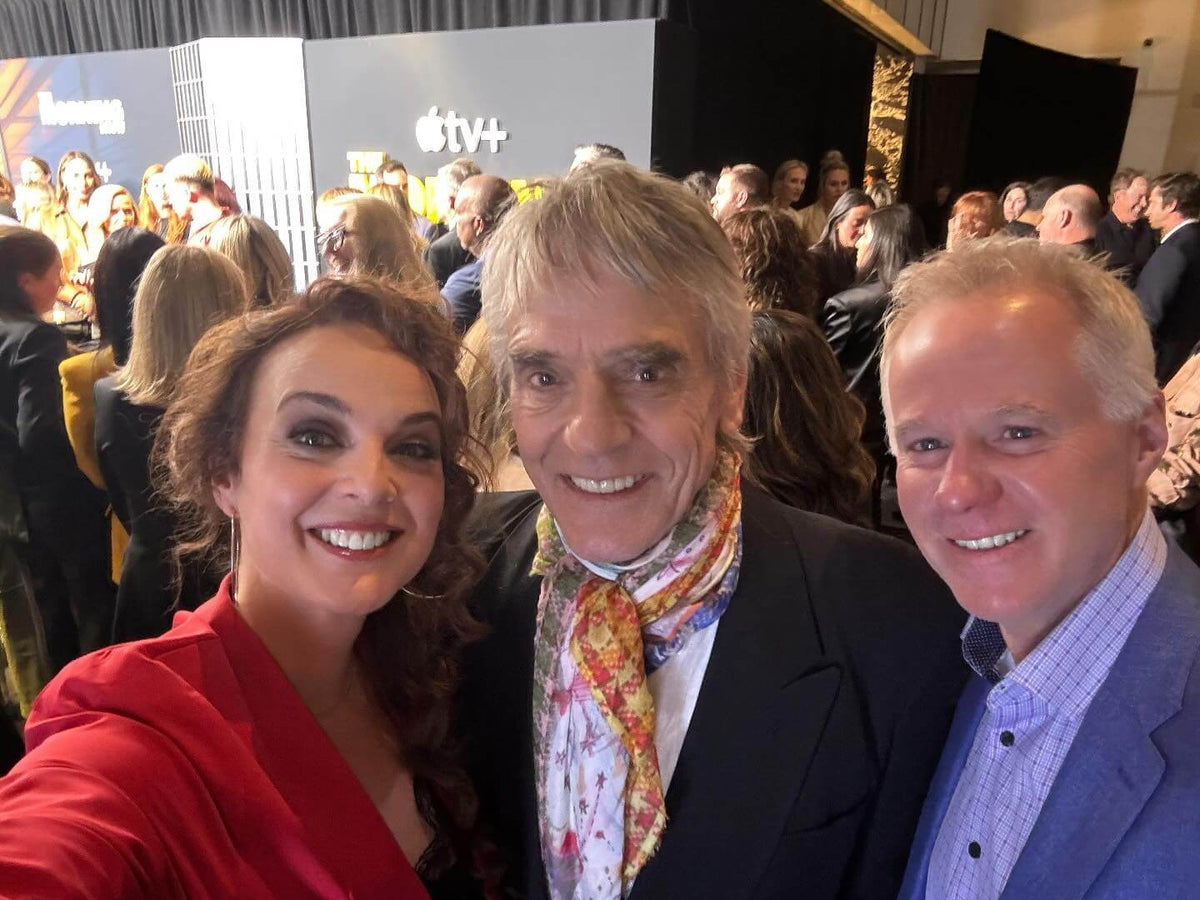 Actress, Singer & Writer, Melissa Errico with cast members at an event, smiling for a selfie.