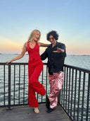 Horse Trainer & Model, Ally Lancaster posing in stylish outfits by the water during sunset.