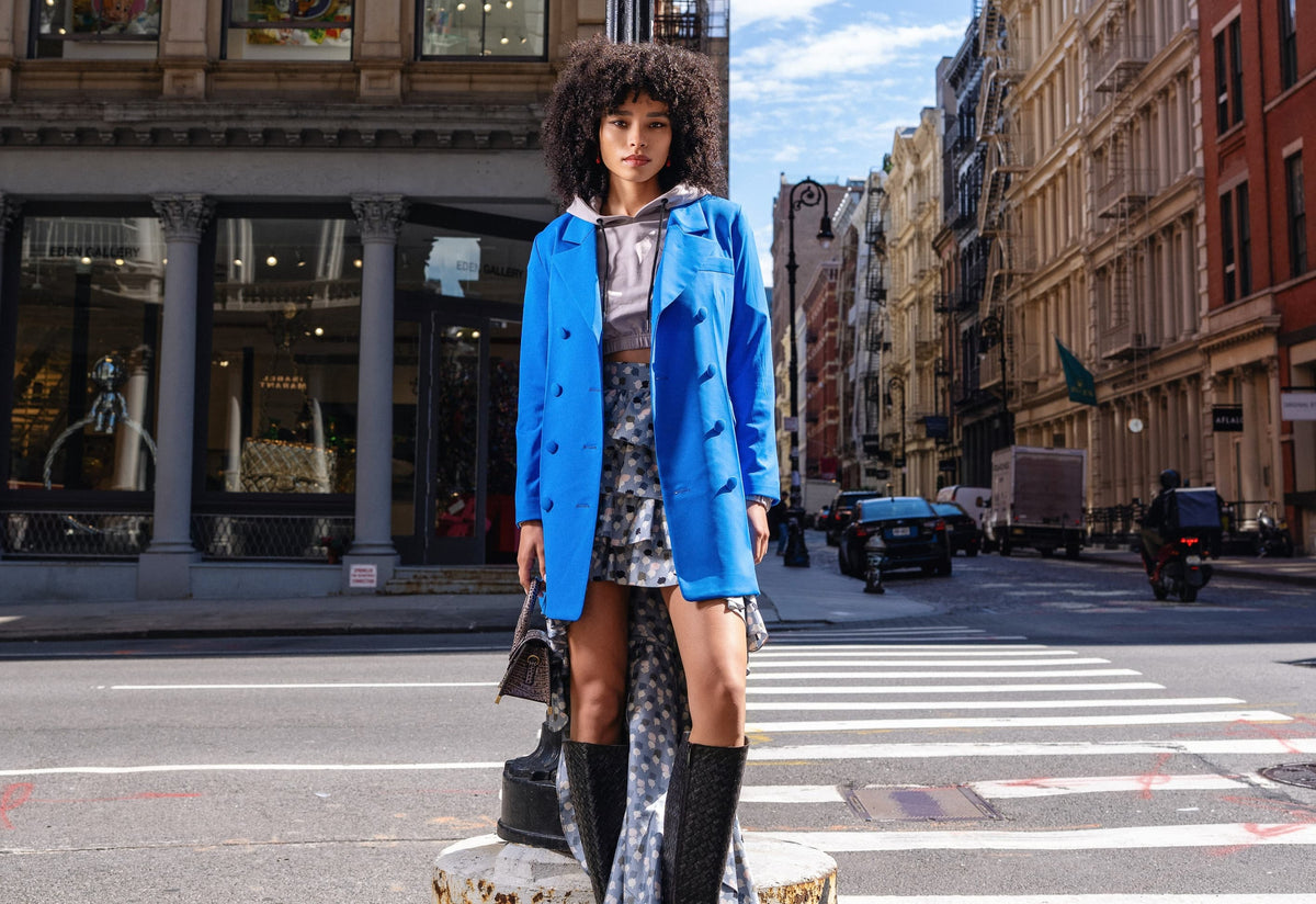 Model is wearing Dahlia Blazer in Forget-Me-Not