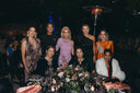 Group of stylish women at 'A Moonlit Garden' Gala, highlighting elegance and celebration under the night sky.