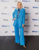Strategic Marketer, Event Producer & Entrepreneur, Megan Reilly in a stylish blue suit at a Westedge event.
