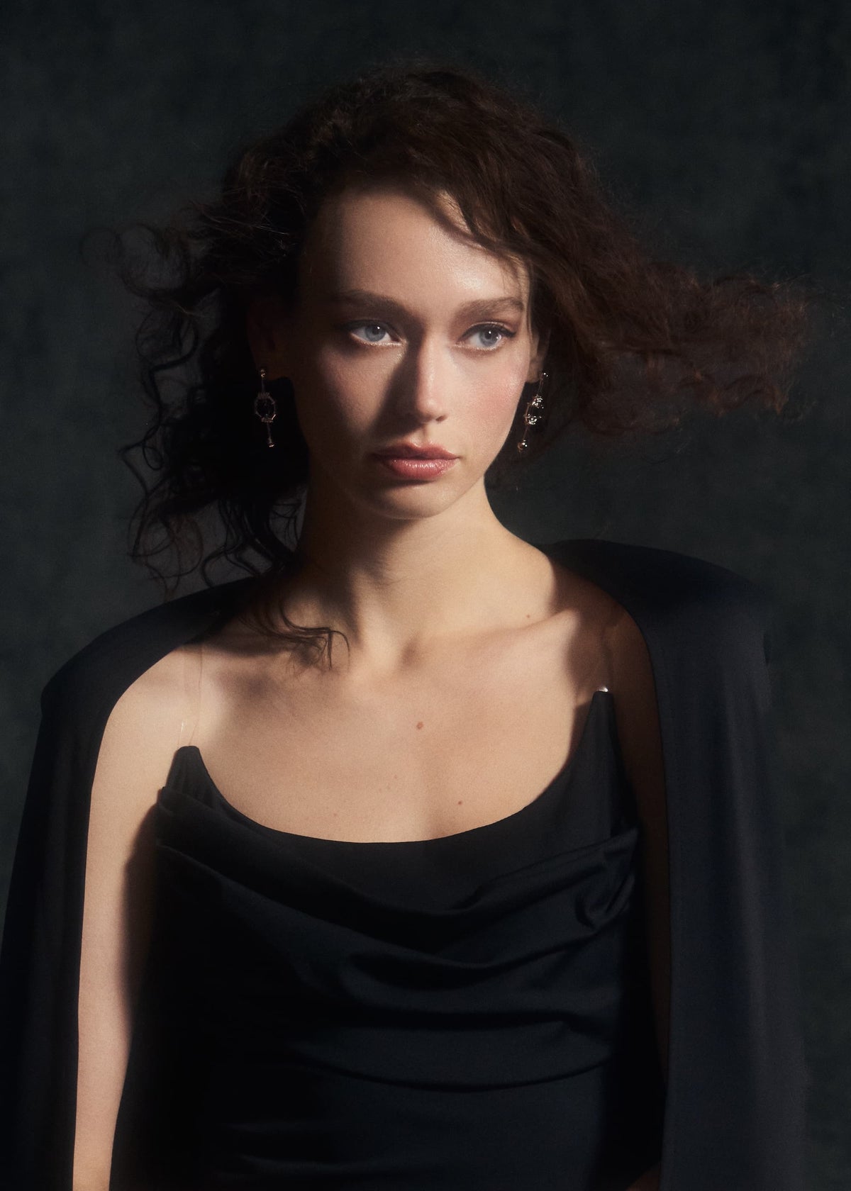 Model is wearing the Come Closer dress in Obsidian