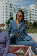 Keep It Moving Set - Marina featuring a flowing lapel tux jacket and sleek pants on a sunny beach.
