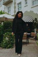 Model wearing the Perfect Form Set - Signature Black, showcasing sophisticated tailoring and a refined silhouette.