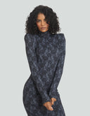 Black Widow midi dress with pointed shoulder pads, designed for the perfect work-to-night transition in floral print.