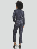 Back view of a woman in a dark denim jumpsuit, featuring a relaxed fit and ankle-length style, ideal for casual wear.