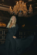 Model showcasing the Promise Me Nothing Set - Obsidian under a chandelier, exuding elegance and modern style.