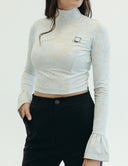 Elegant cropped top with intricate lace, belle style cuffs, and a chic hat design, perfect for versatile styling.