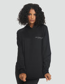 Model wearing a stylish Original MMB Hoodie with logo, showcasing a modern athletic look.