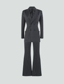 Striped Night power suit featuring a tailored blazer and flared pants, perfect for versatile occasions.