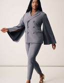 Model wearing the Cool Intentions Blazer with batwing sleeves and matching pants, showcasing elegant style.