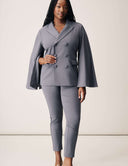 Model wearing the Cool Intentions Blazer with batwing sleeves and matching pants for a stylish look.