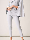 Cool Intentions Pant showcased with a stylish jacket, featuring elegant pleats and a modern fit.