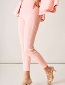 Model wearing Cool Intentions Pant in soft pink, featuring double pleats and a slip-on design.