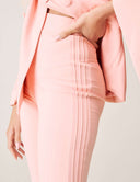 Detail of the Cool Intentions Pant featuring double pleats and a modern design in soft pink fabric.