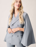 Model wearing the Cool Intentions Blazer with batwing sleeves and dramatic satin lapels in grey.