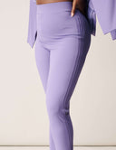 Model showcasing Cool Intentions Pant in lavender with double pleats and modern design.