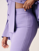 Close-up of the Cool Intentions Pant showcasing double pleats and modern design in a stylish outfit.
