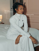 Enza Marie Top worn by a model, showcasing long sleeves and mock neck, highlighting its easy-care fabric and stretch.