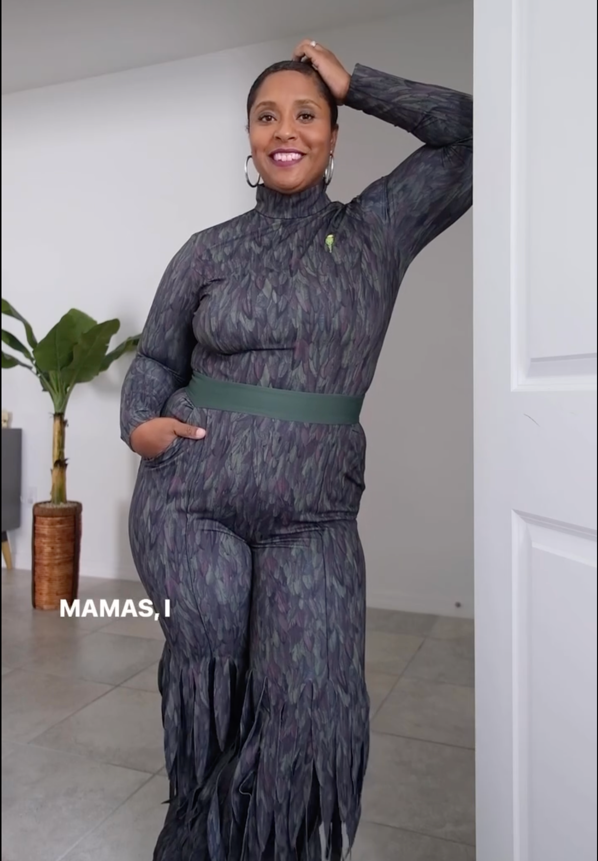 Trendy woman in Going Somewhere, posing confidently in a modern interior space.