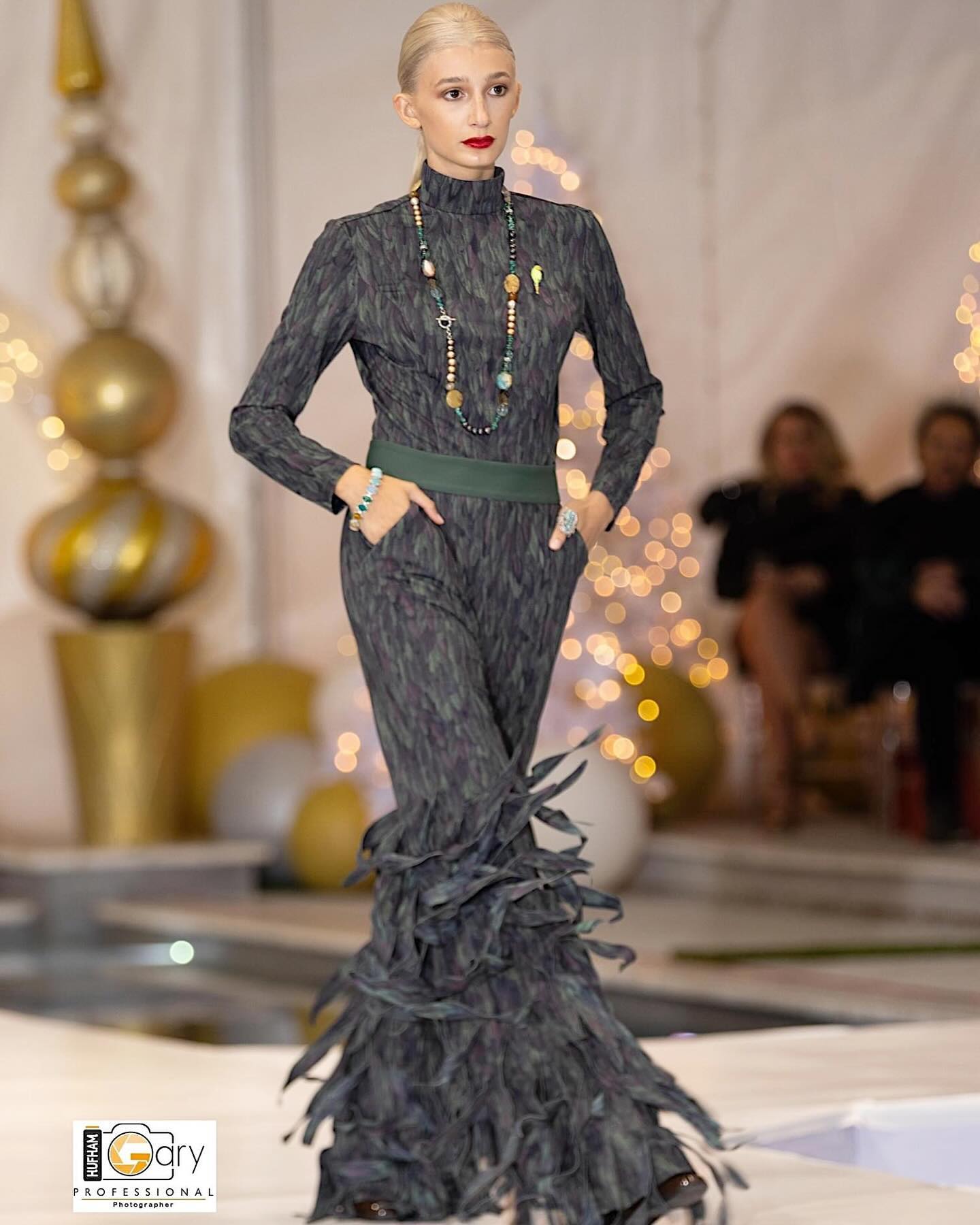 Model showcasing Going Somewhere and elegant accessories on the runway at a fashion event.