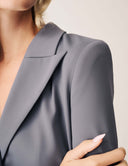 Close-up of a model wearing the Keep It Moving Blazer, showcasing its elegant lapel and tailored design.