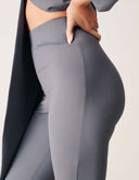 Close-up of a model wearing the Keep It Moving Pant in gray, showcasing the sleek silhouette and modern design.