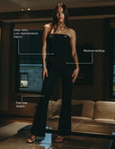 Model wearing Look At Me Jumpsuit, showcasing moisture-wicking and four-way stretch features in a stylish setting.