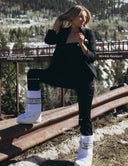 Model wearing Look At Me Jumpsuit outdoors, showcasing lightweight, wrinkle-resistant, and machine washable features.