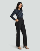 Luxe Long Sleeve Bodysuit in black lace print, paired with tailored black pants, showcasing stylish, comfortable fashion.