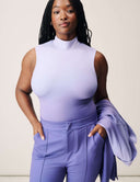 Model wearing a Luxe Ombre Bodysuit in Lavender Haze, featuring turtleneck design and chic styling.