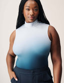 Luxe Ombre Bodysuit displayed on a model featuring a turtleneck design and a vibrant ombre gradient in blue.