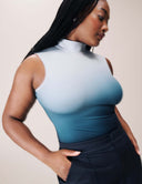 Luxe Ombre Bodysuit in vibrant ombre gradient featuring a turtleneck design and sleek silhouette.
