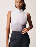 Luxe Ombre Bodysuit featuring a sleek turtleneck design in a vibrant ombre gradient.