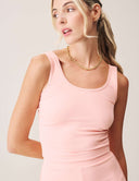 Model wearing Luxe Tank Top in soft pink, showcasing its classic crew neckline and flattering silhouette.